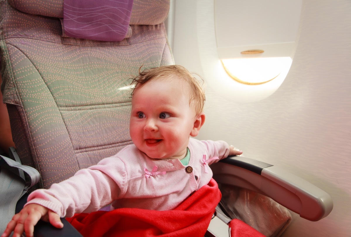 baby smiling on airplane