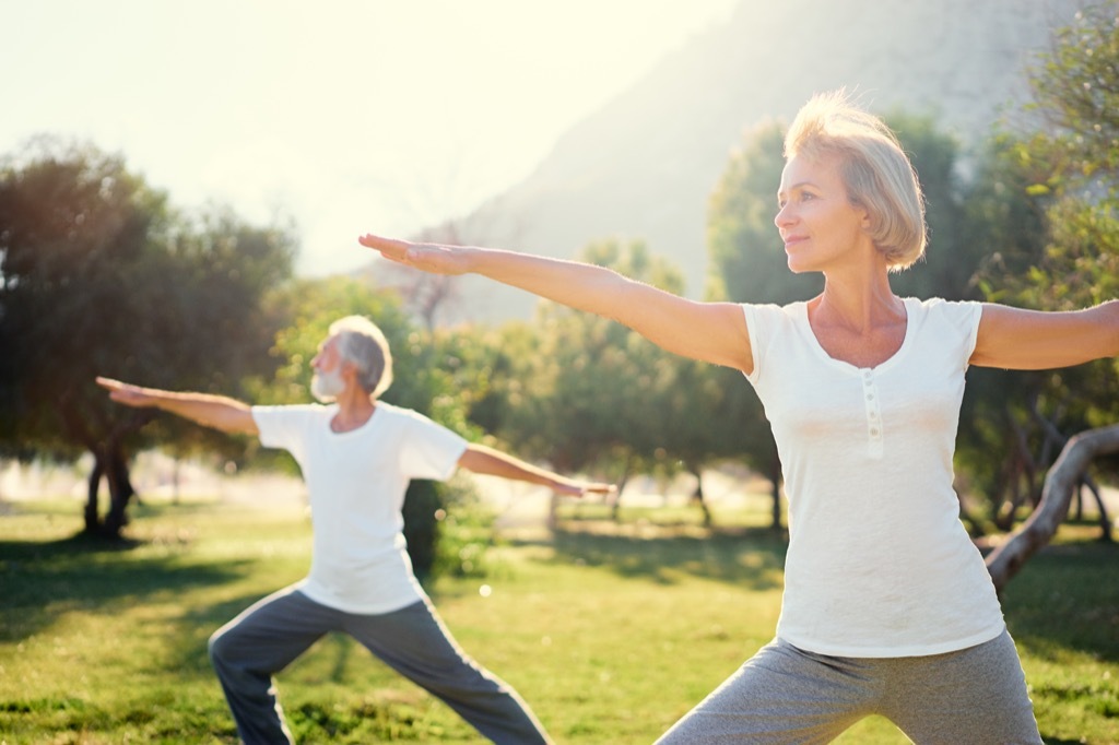 Older Couple Doing Yoga Energy After 40