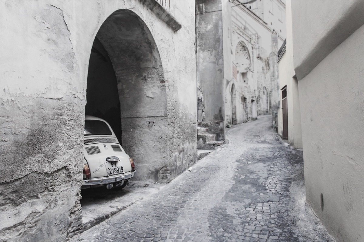 White fiat in alleyway