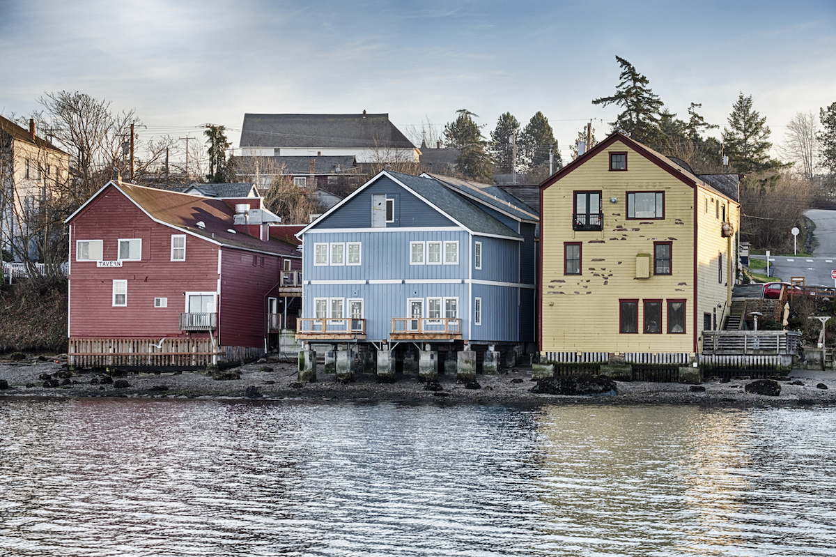 Three old, colorful buildings anchor the waterfront strip of downtown Coupeville on Whidbey Island in Washington State.