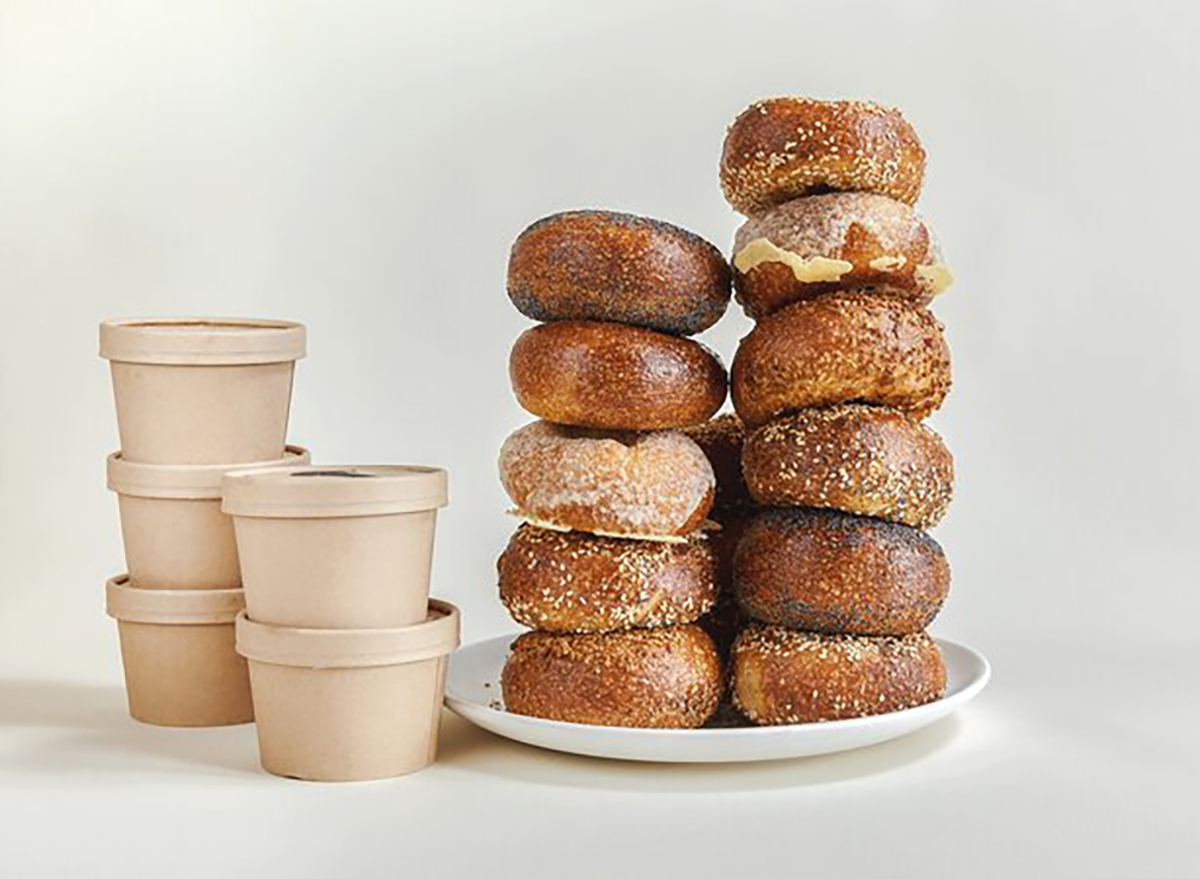 stack of bagels with tubs of cream cheese