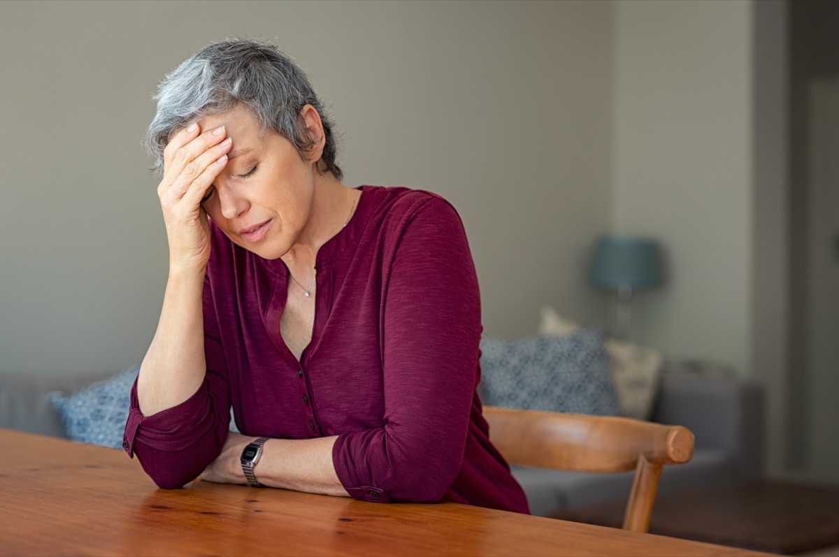 Stressed senior woman at home