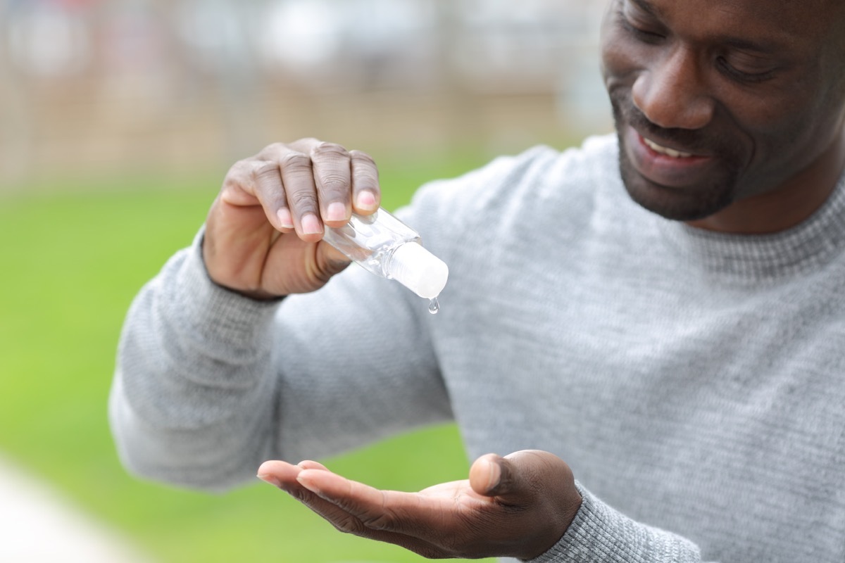 Man pouring hand sanitizer