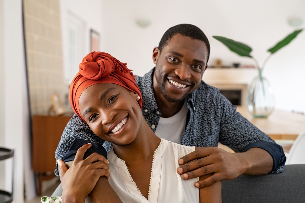 man and woman smiling at the camera