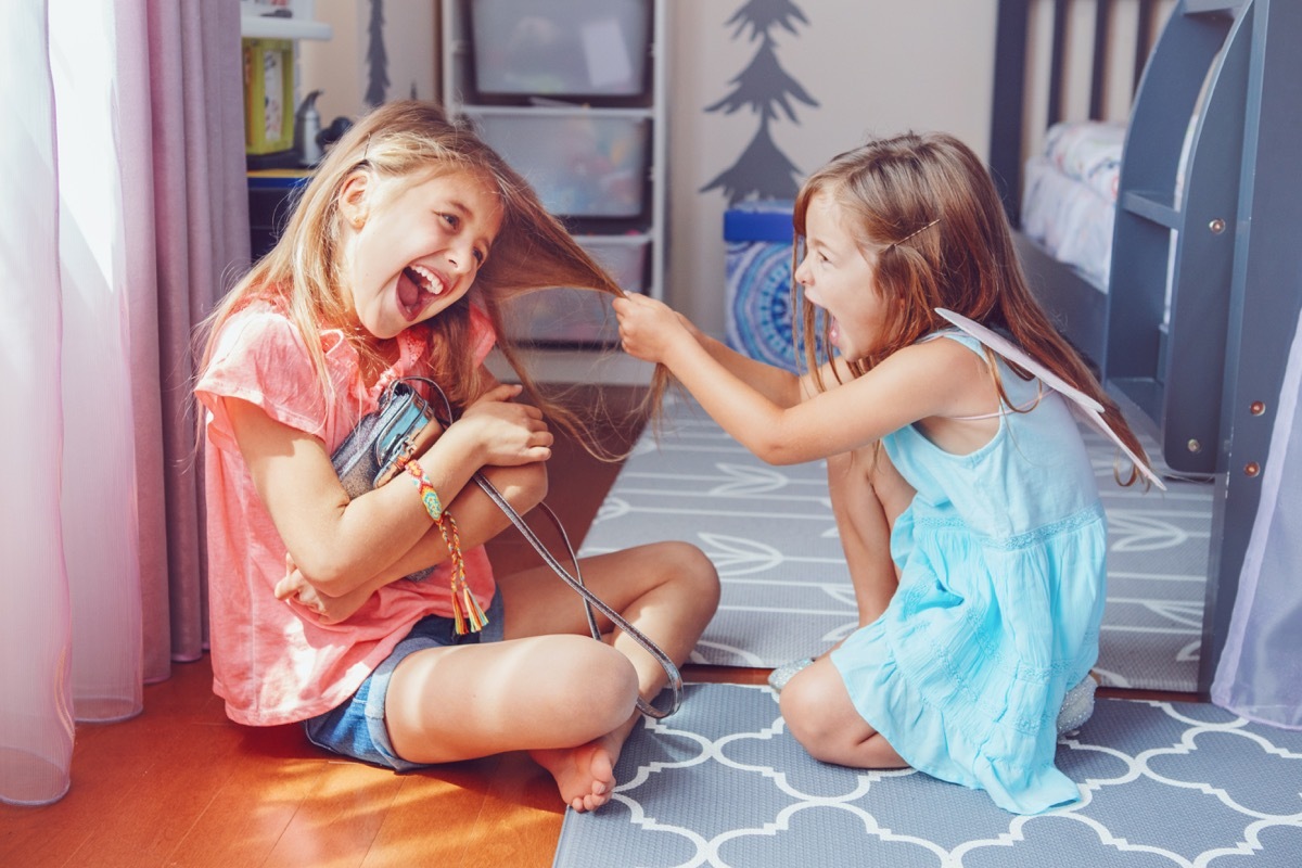 two siblings fighting in a shared room, middle child