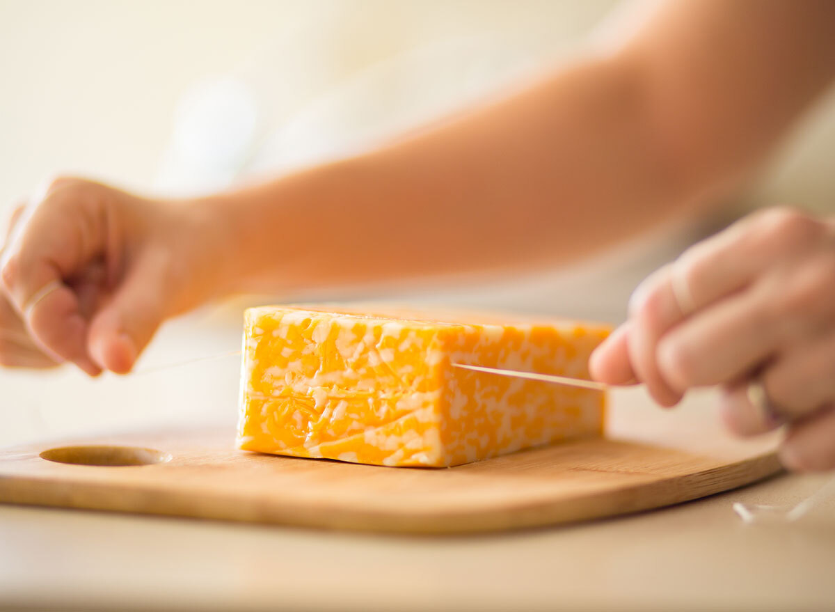 Easily cutting cheese with a piece of floss