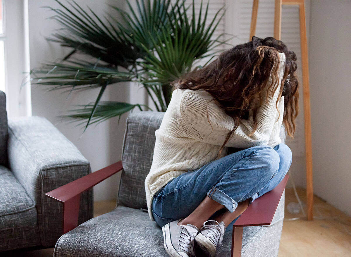 woman panicking in chair - how does alcohol affect the brain