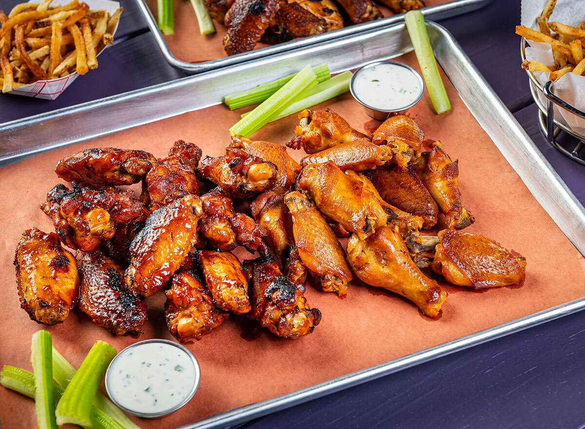 plate of chicken wings with dip