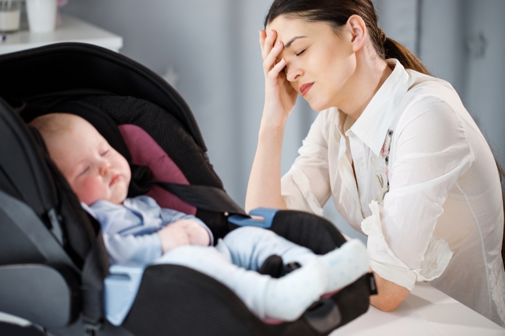 Unhappy Mother with Baby regrets