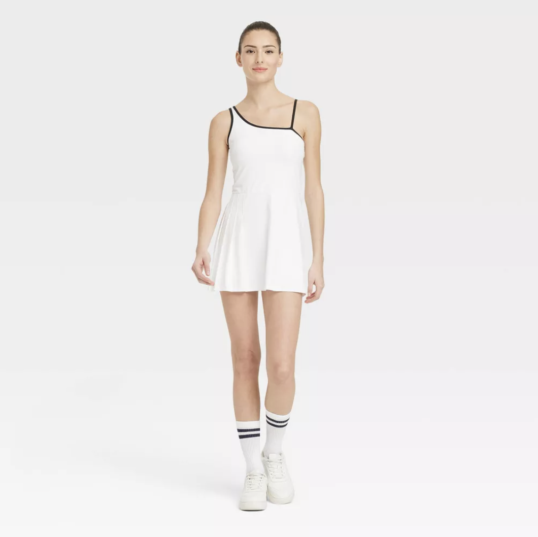 model wearing black and white athletic dress from Target