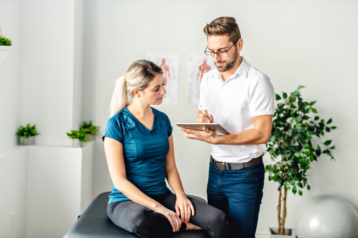 woman talking to chiropractor