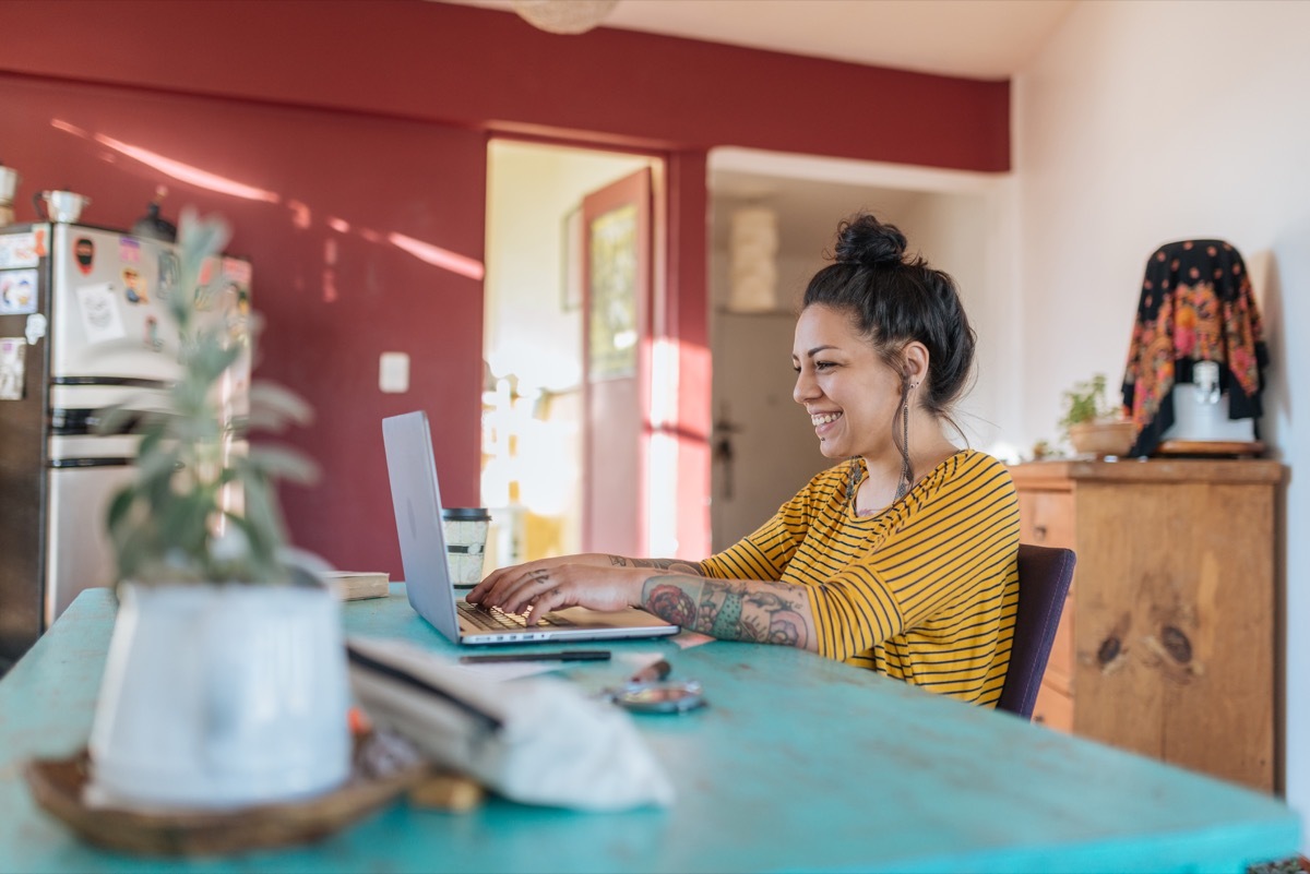 woman working on laptop at home