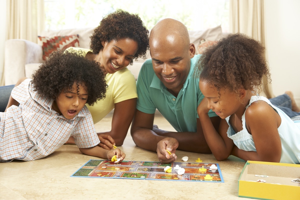 Family playing board game