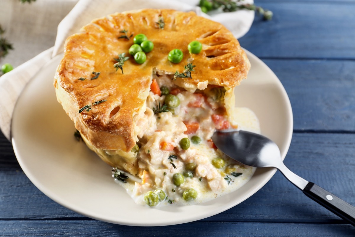 chicken pot pie, silver spoon in pie on plate