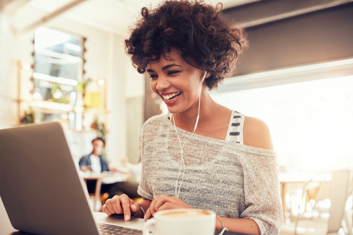 Woman smiling at computer