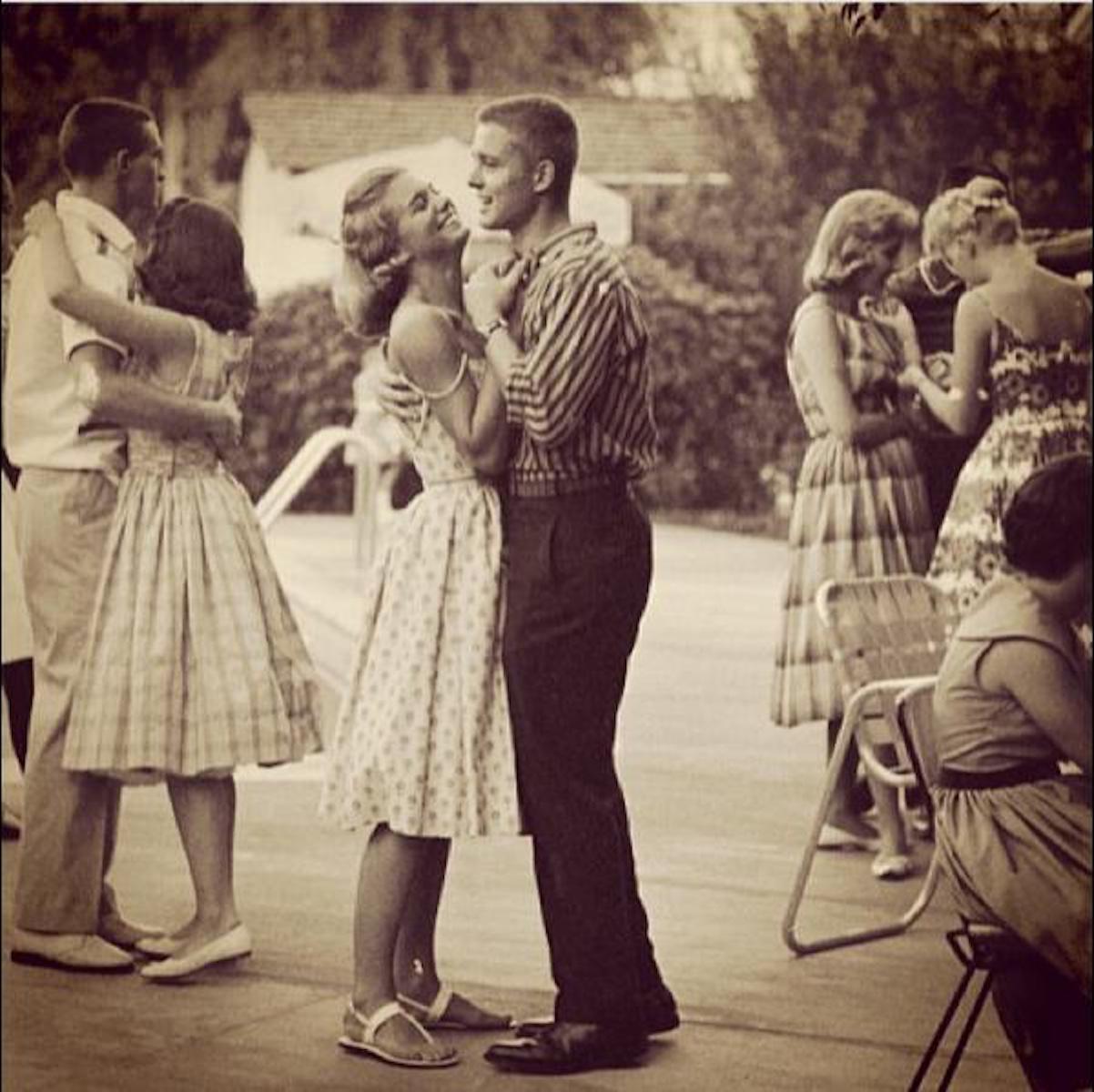 vintage teen couple dancing outside ini 1950s