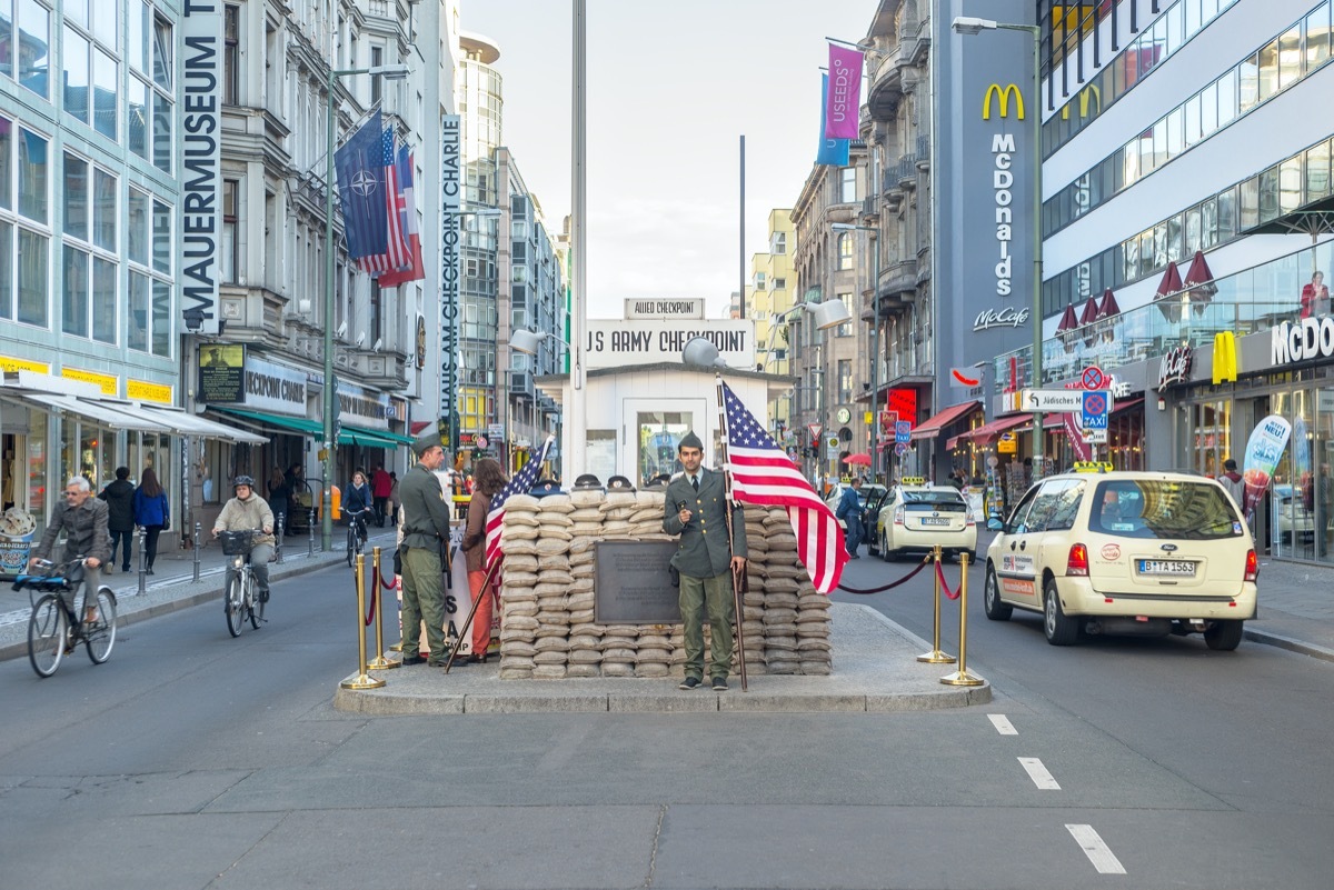 checkpoint charlie in berlin with guards standing by