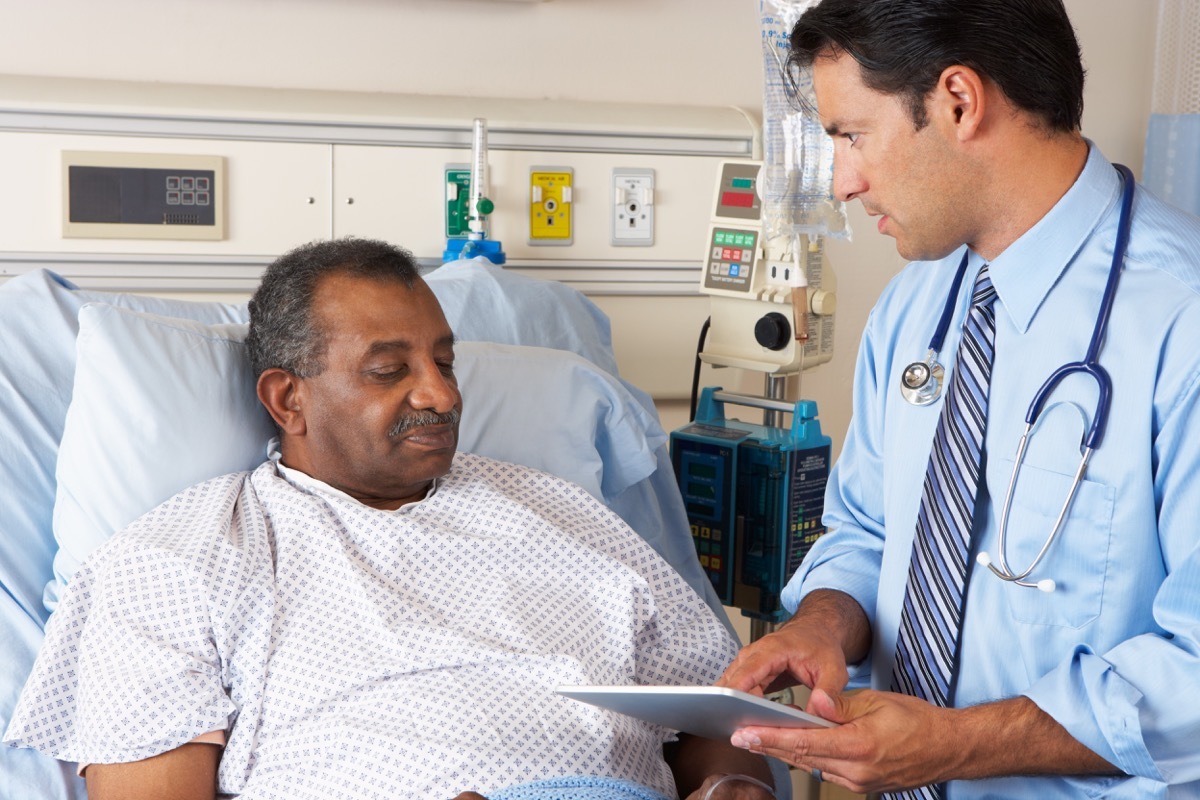 man getting lab work talking to doctor about results, health questions after 50