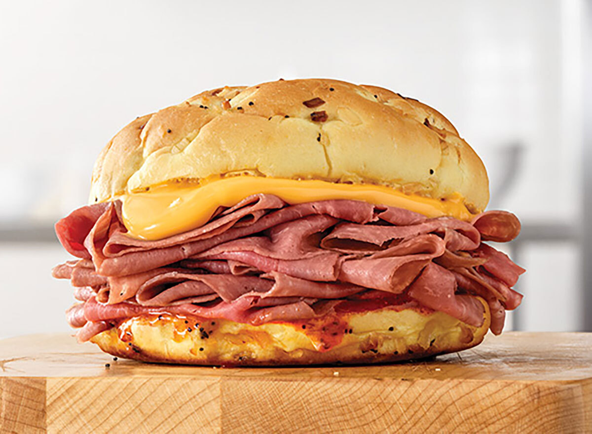 arbys beef n cheddar sandwich on wooden block