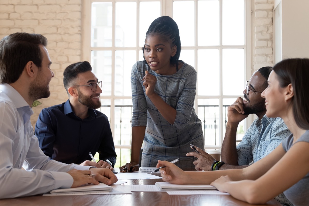 Young Black Woman Leading a Meeting