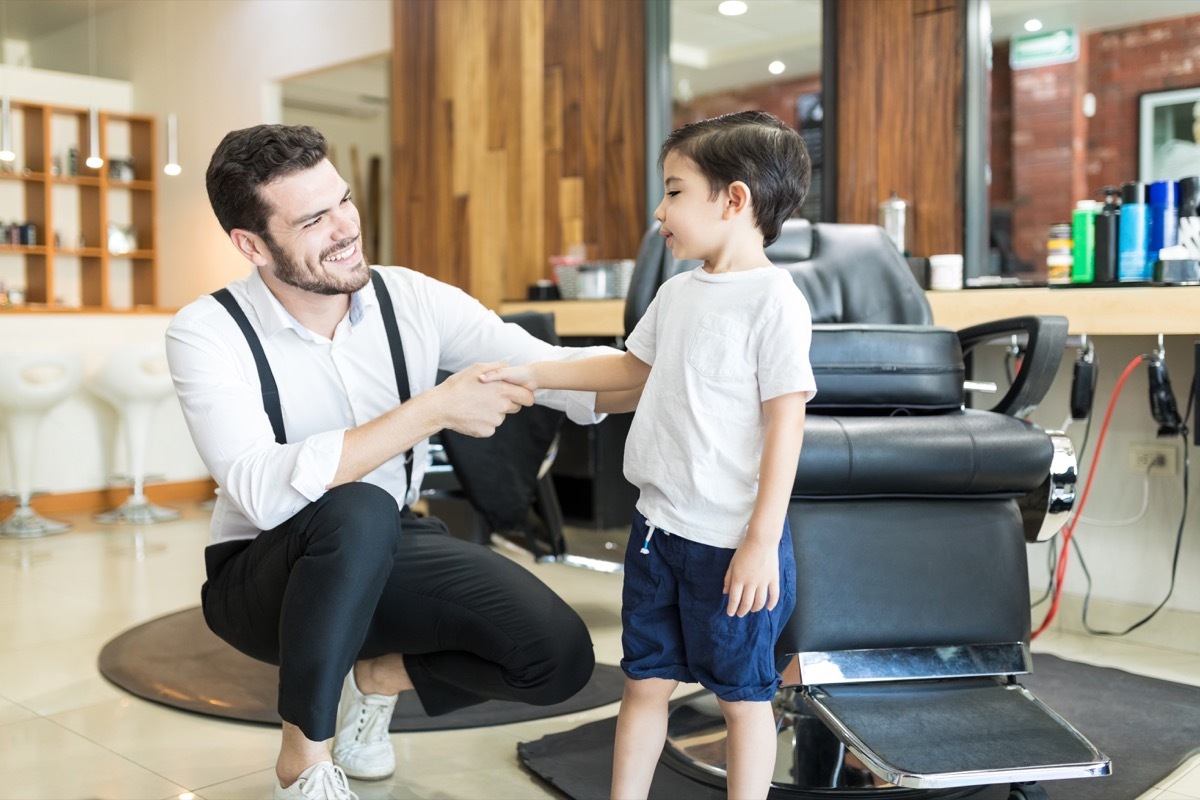 little boy shaking hands with barber old-fashioned manners