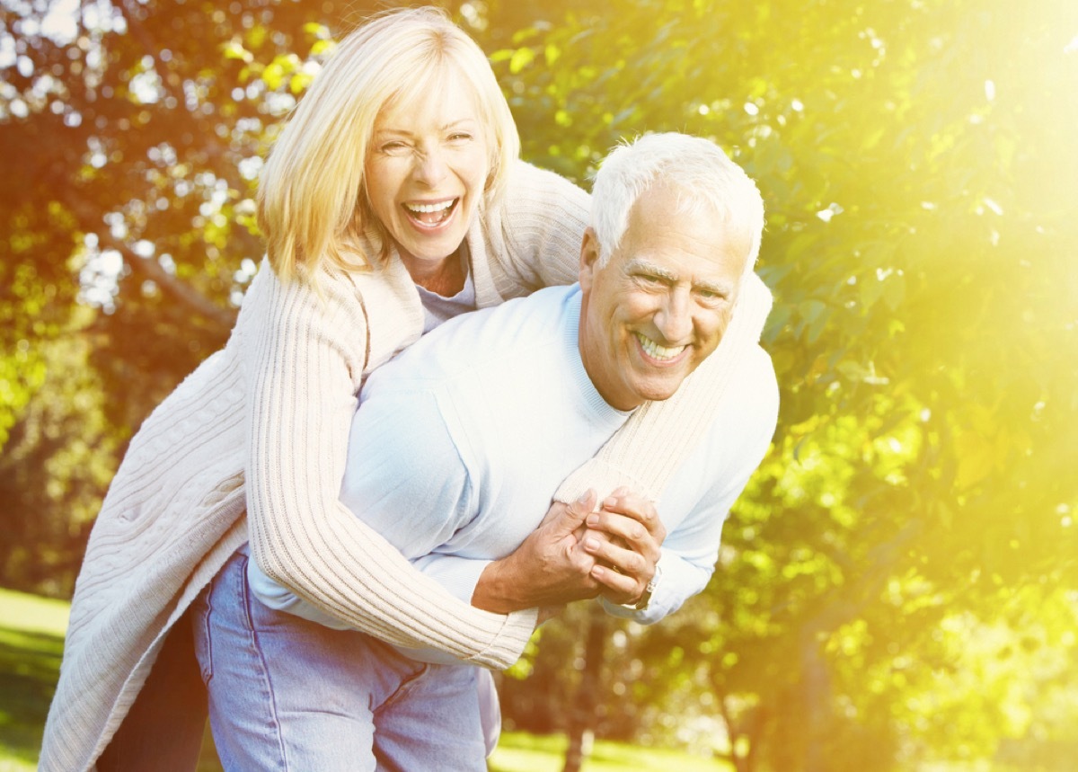 older couple doing a piggyback outside, better wife after 40