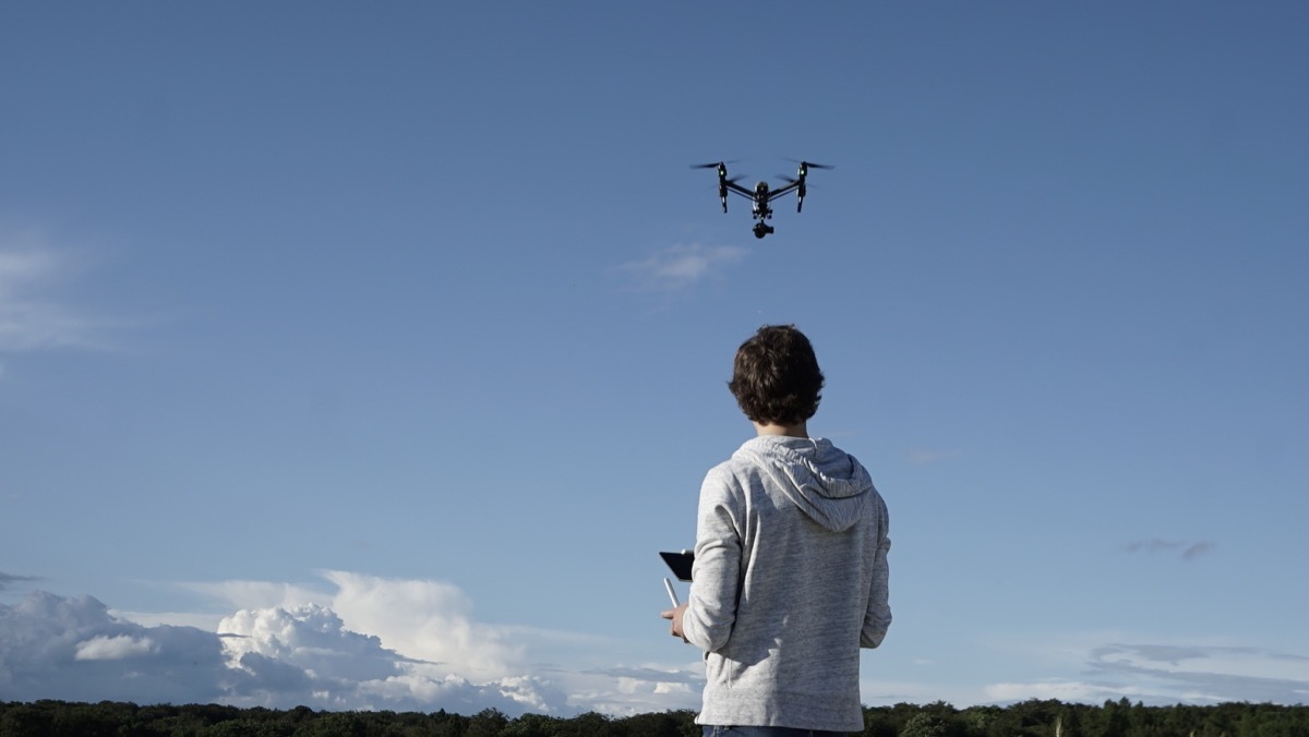 man flying a drone