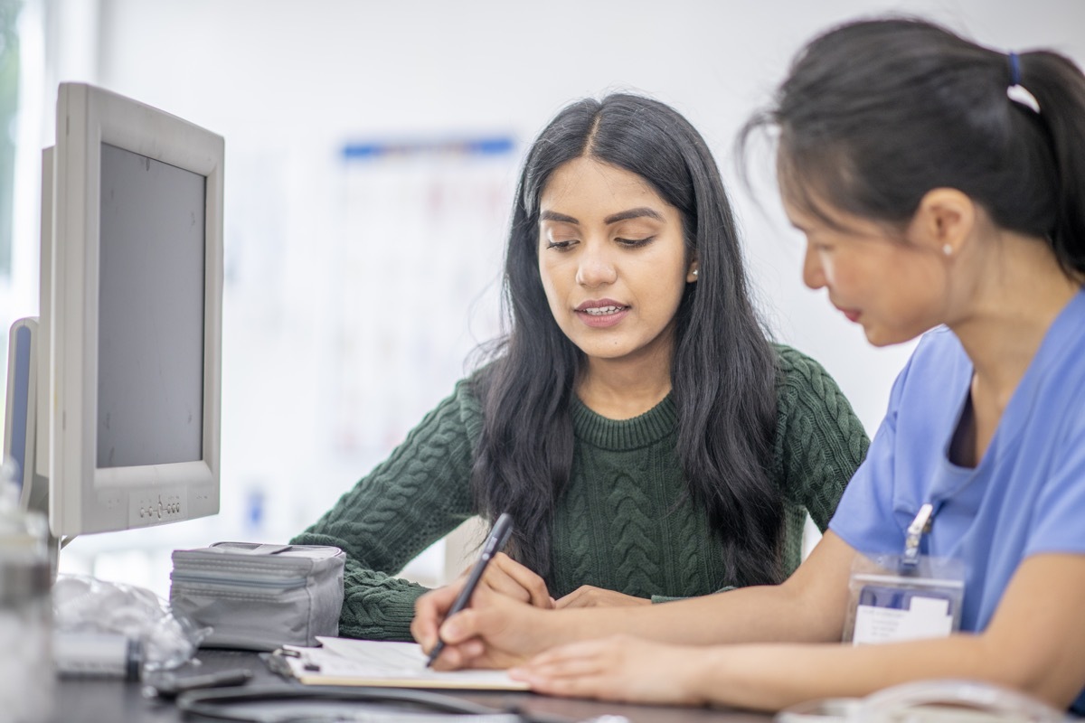 young teenage talking to doctor