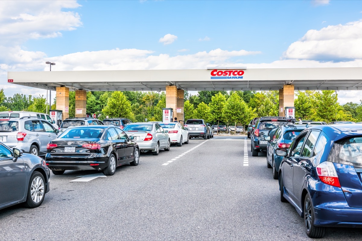 Fairfax, USA - September 8, 2017: People in cars waiting in long lines to fill up vehicles with gas at Costco store in Virginia