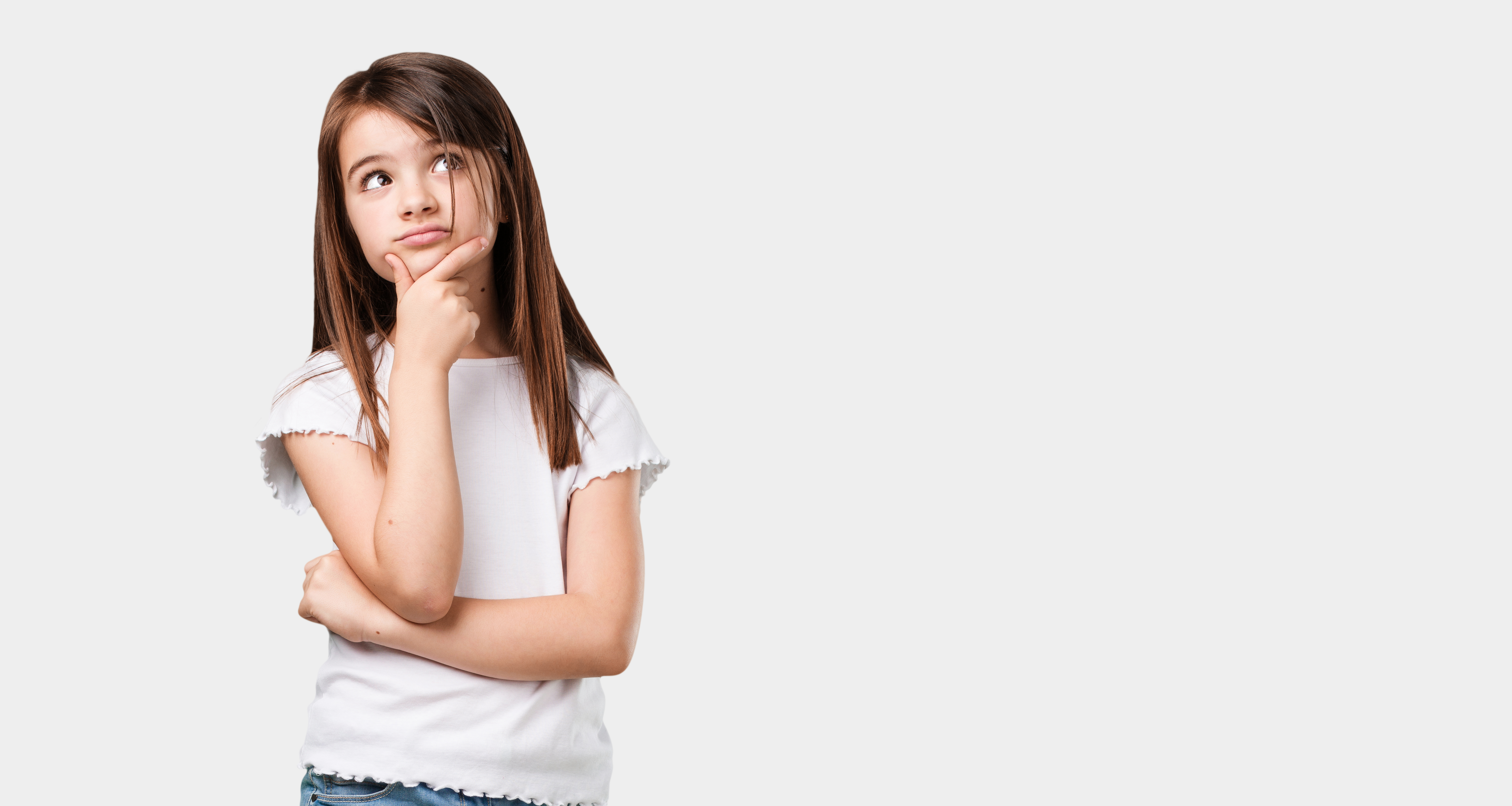 little girl resting her hand in her chin