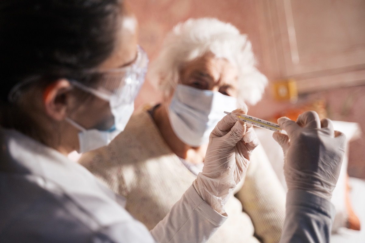 Female doctor doing at home visit to a patient.