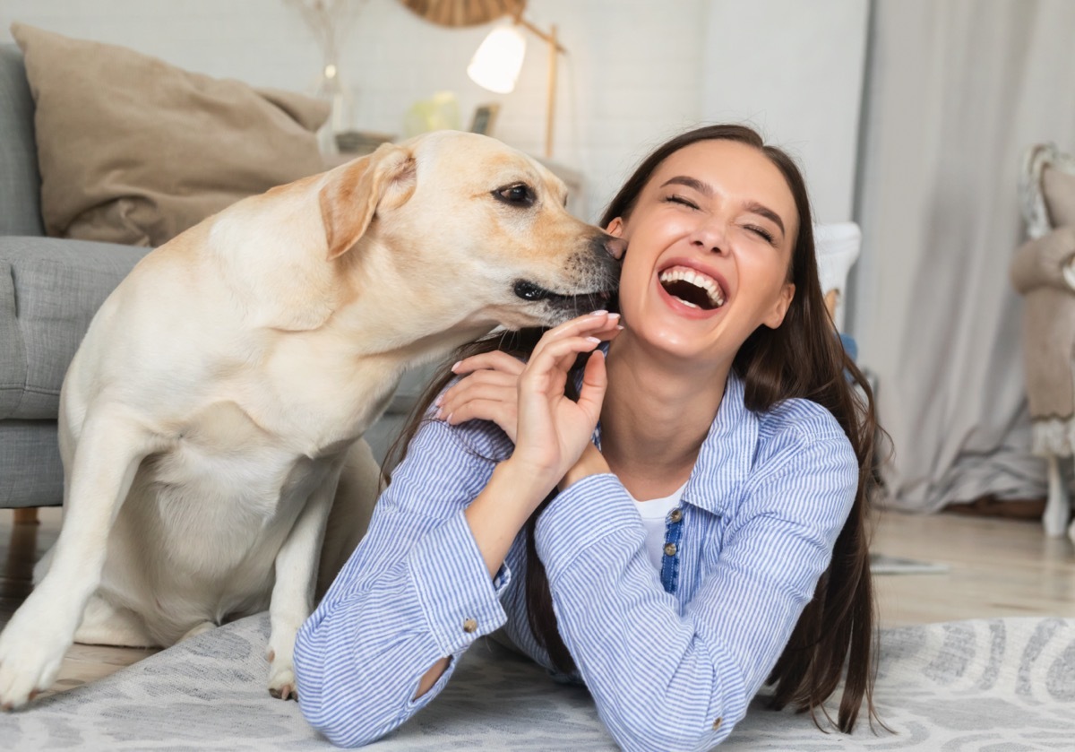 Dog nuzzling woman