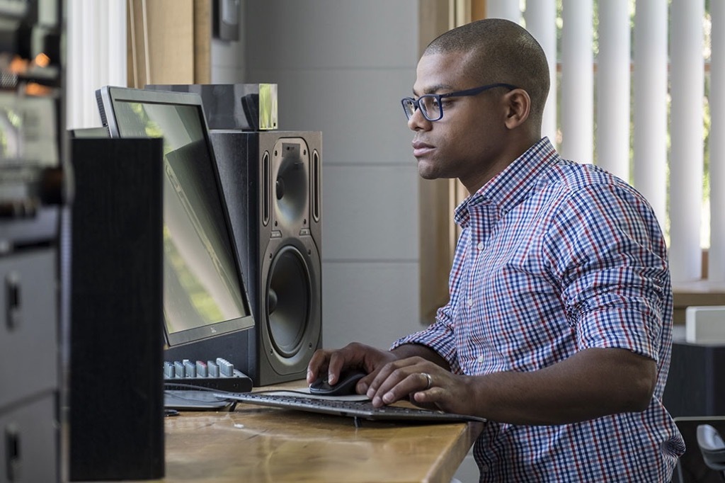 man at standing desk Smartest Men Get Ahead