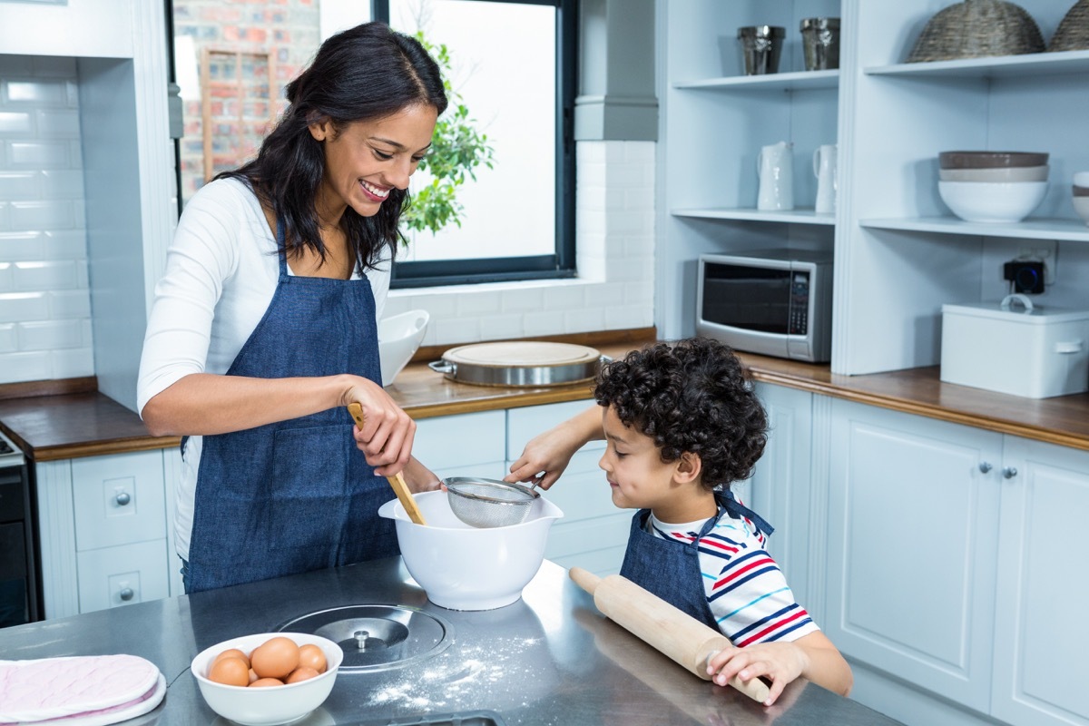 Mother and son baking in a kitchen