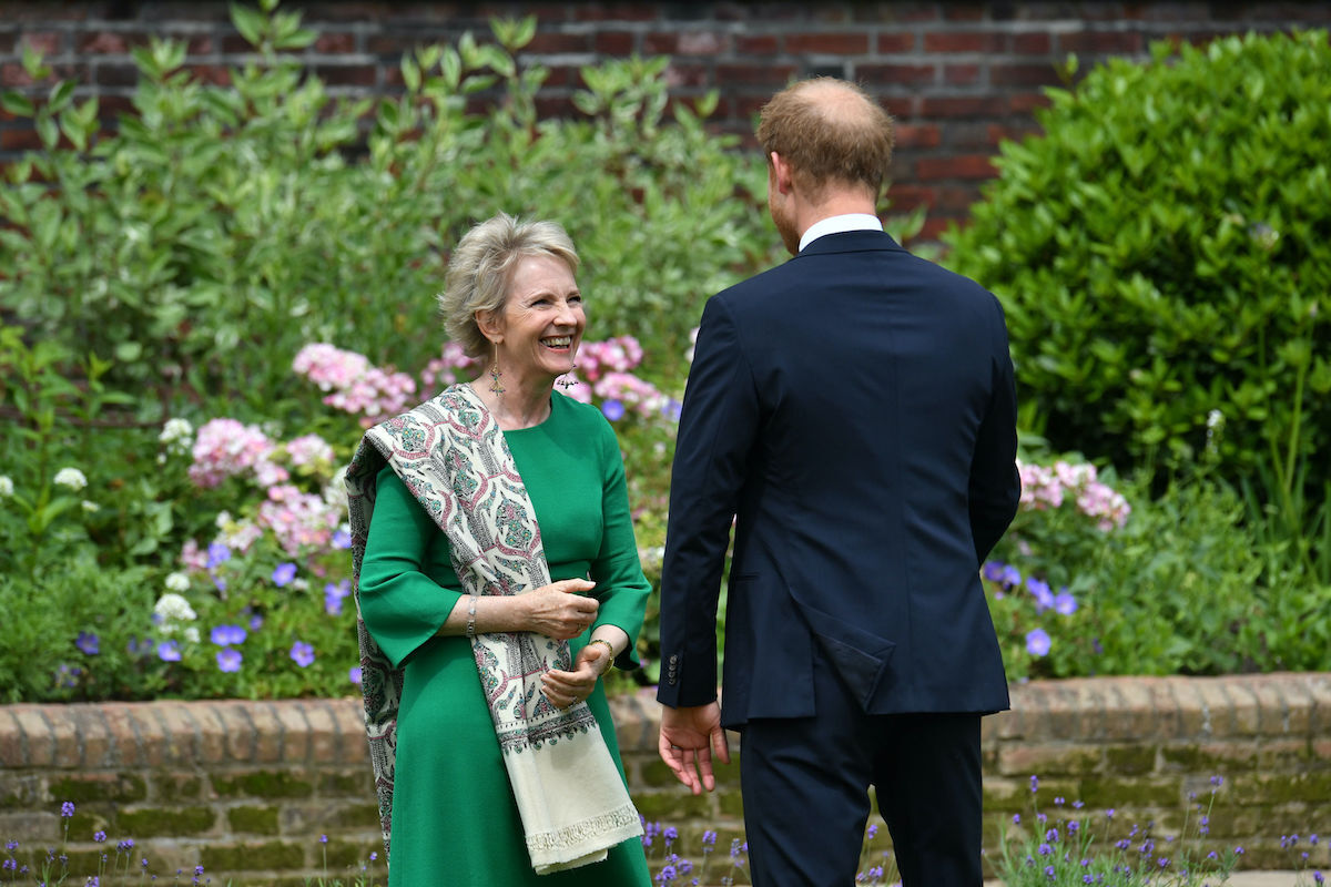 Prince Harry, Duke of Sussex greets Julia Samuel, founder of Child Bereavement UK during the unveiling of a statue of Diana, Princess of Wales, in the Sunken Garden at Kensington Palace