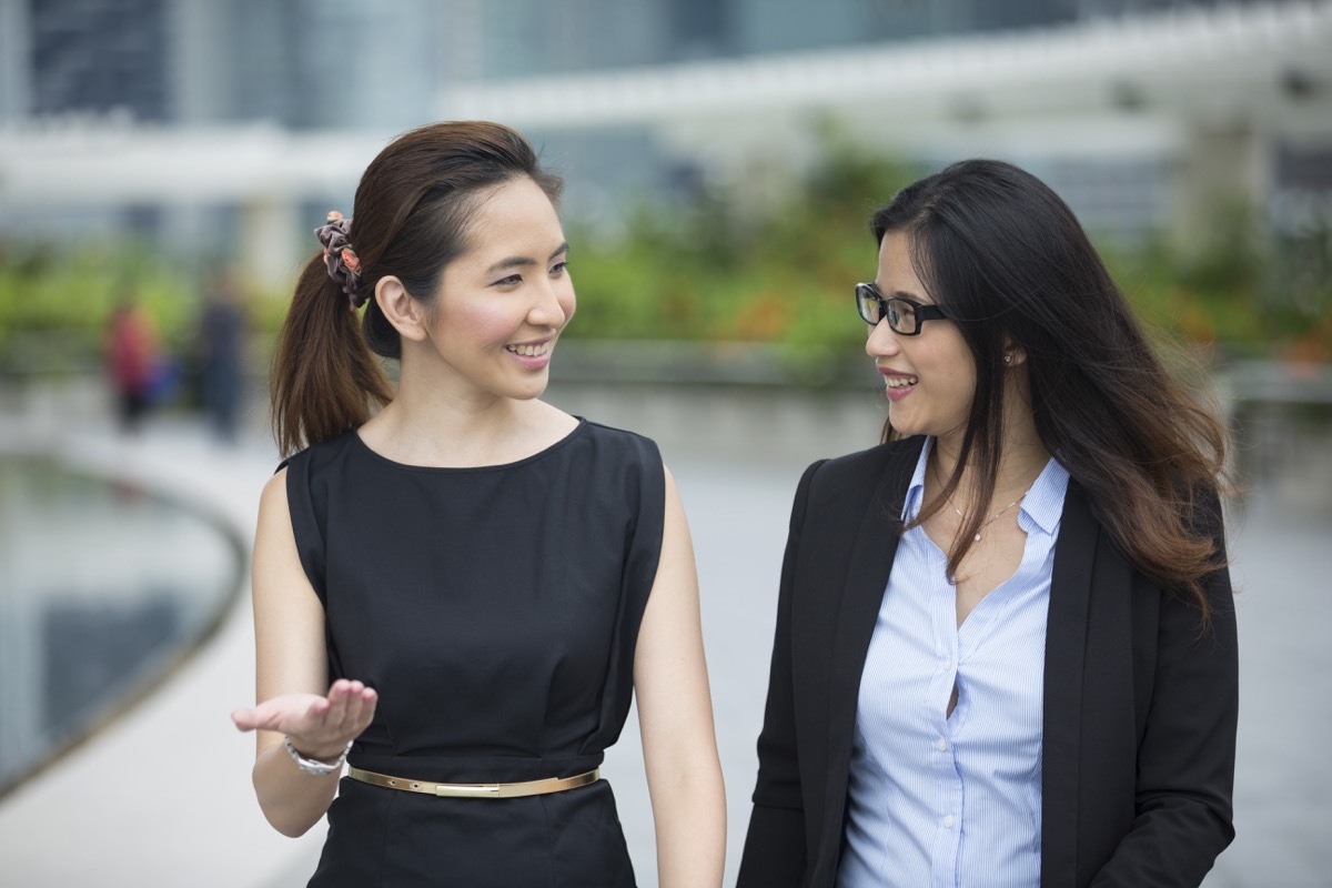 two young asian women working outdoors