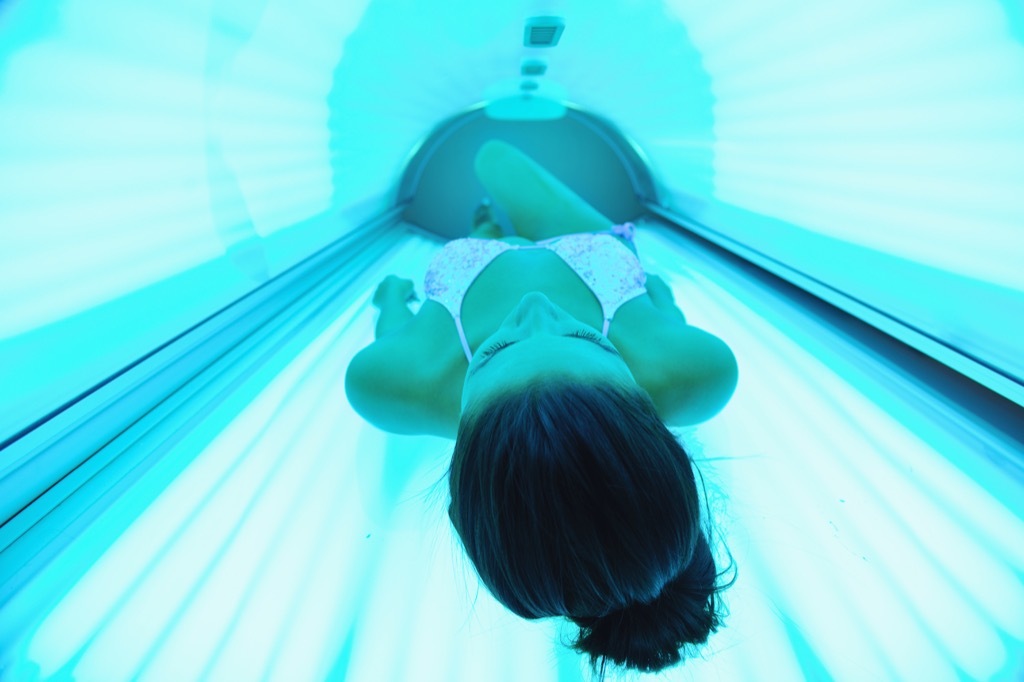 woman tanning in solarium