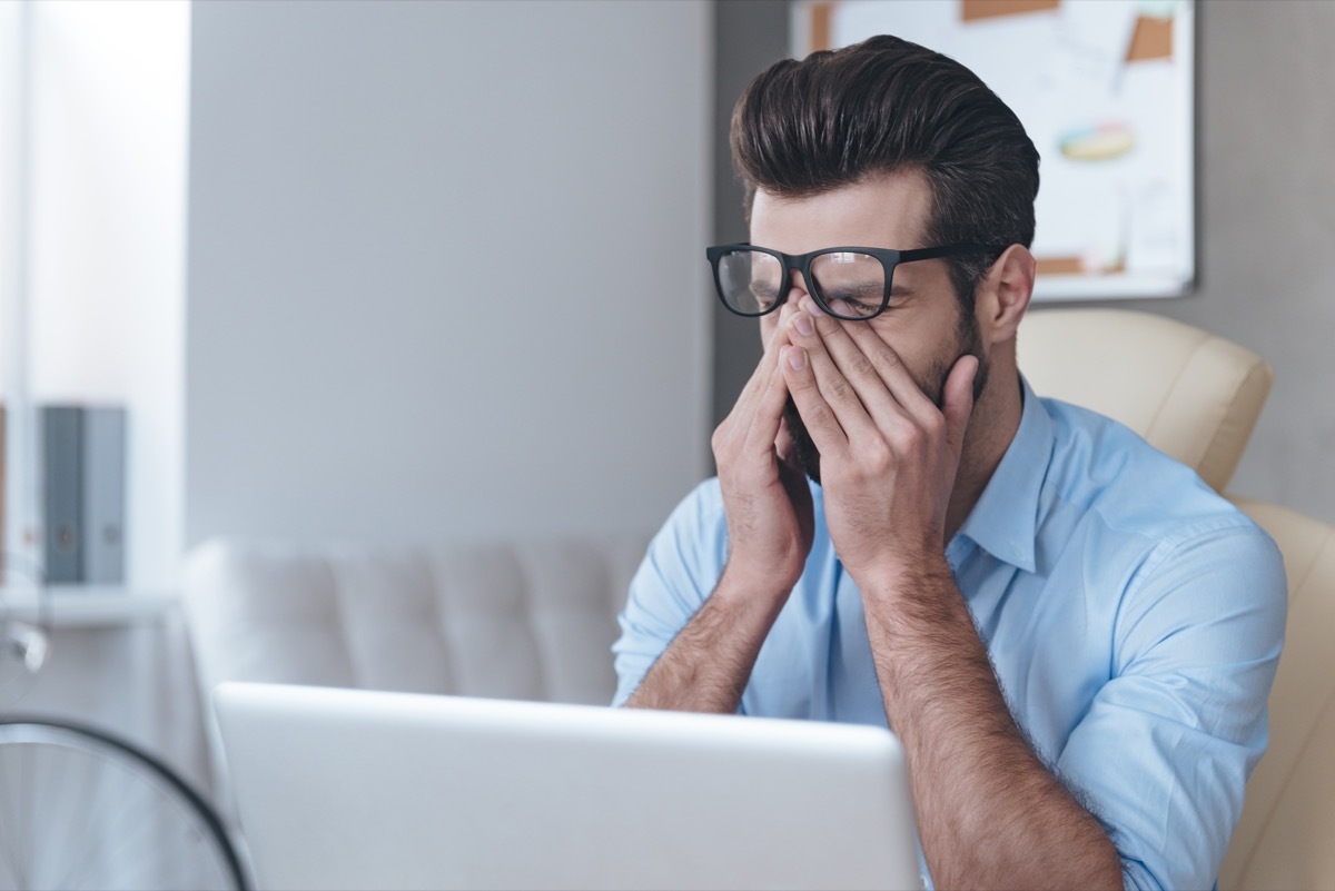 Man touching face because he is stressed