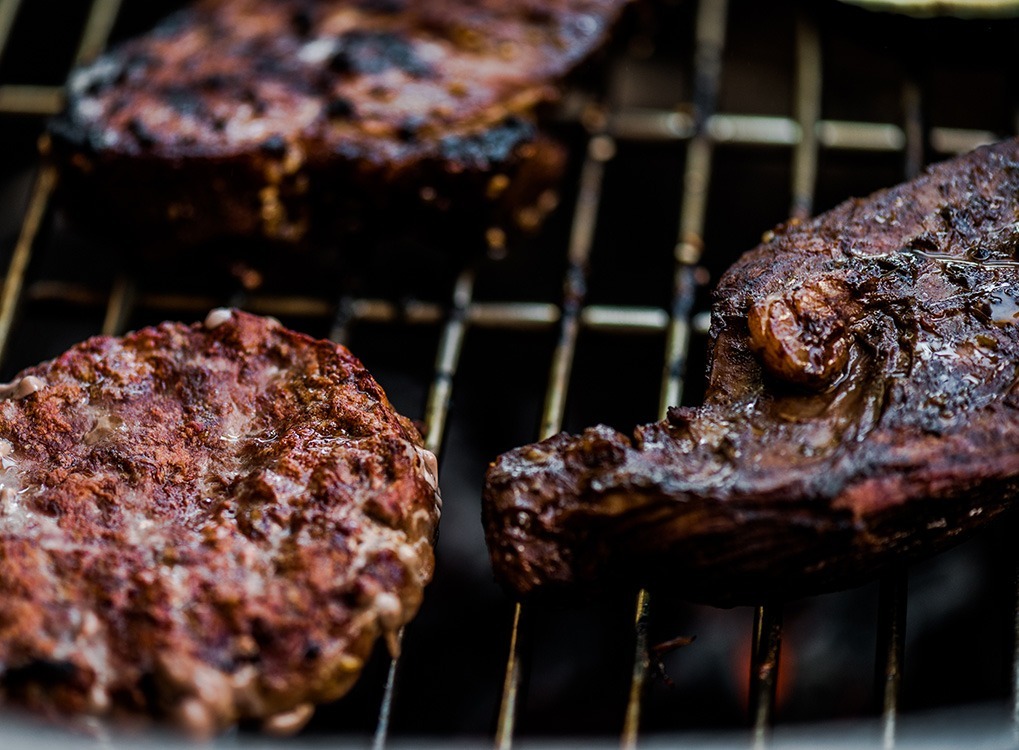 steaks on grill, july fourth traditions