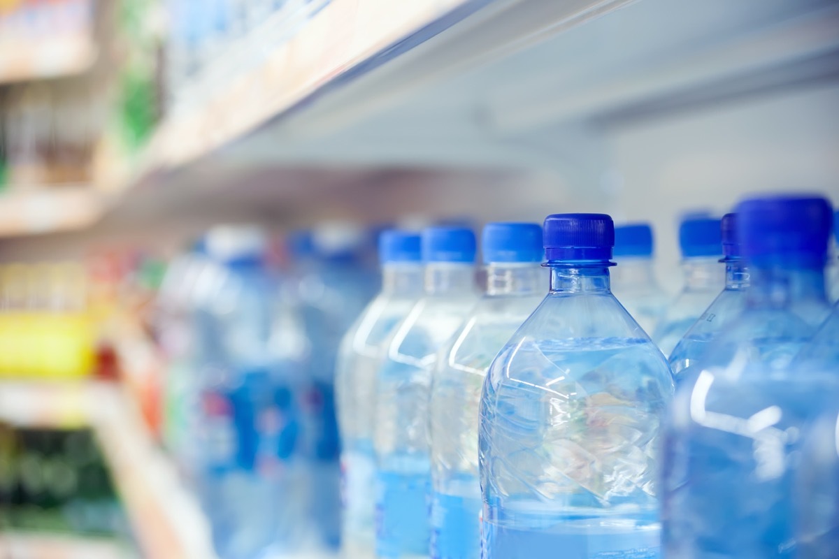 drinking bottled water in store