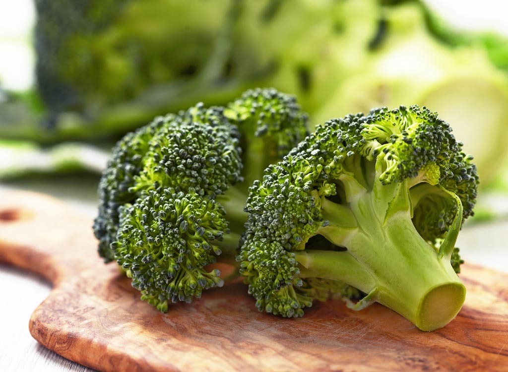 Broccoli on a wooden cutting board - calcium rich foods