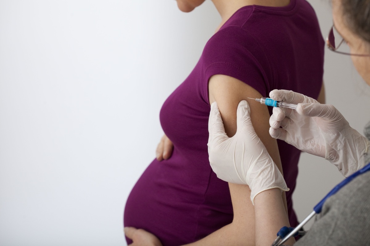 Pregnant woman getting COVID vaccine