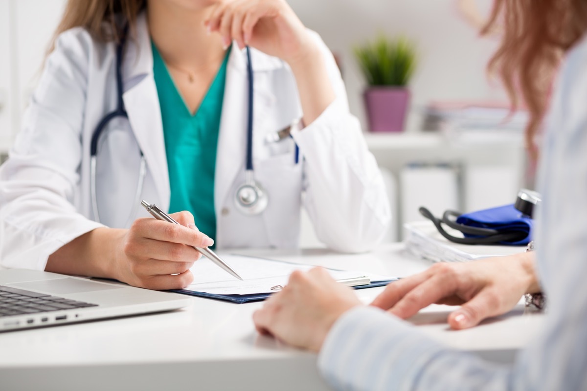 Doctor talking with patient