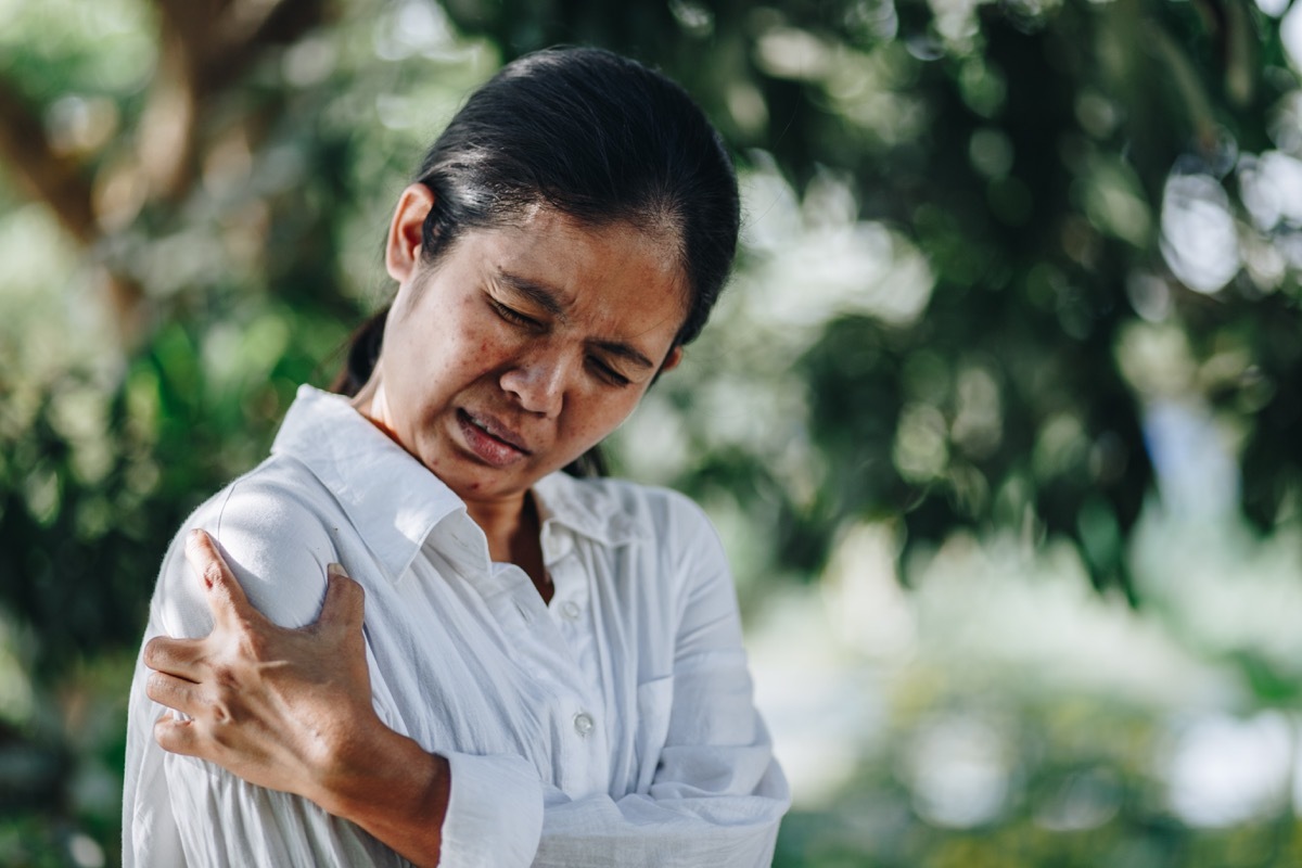 Woman with pain in shoulder and upper arm, Ache in human body , office syndrome , health care concept