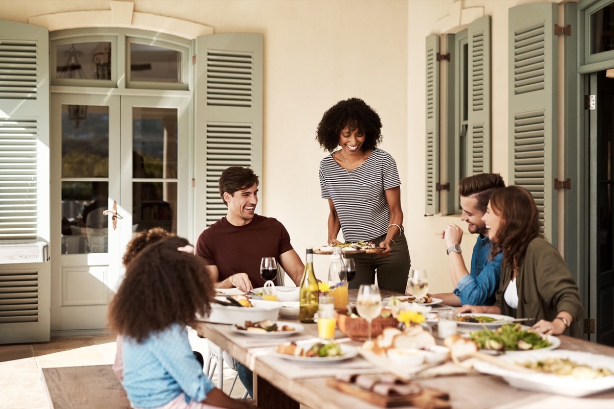 A group of people gather to share a meal