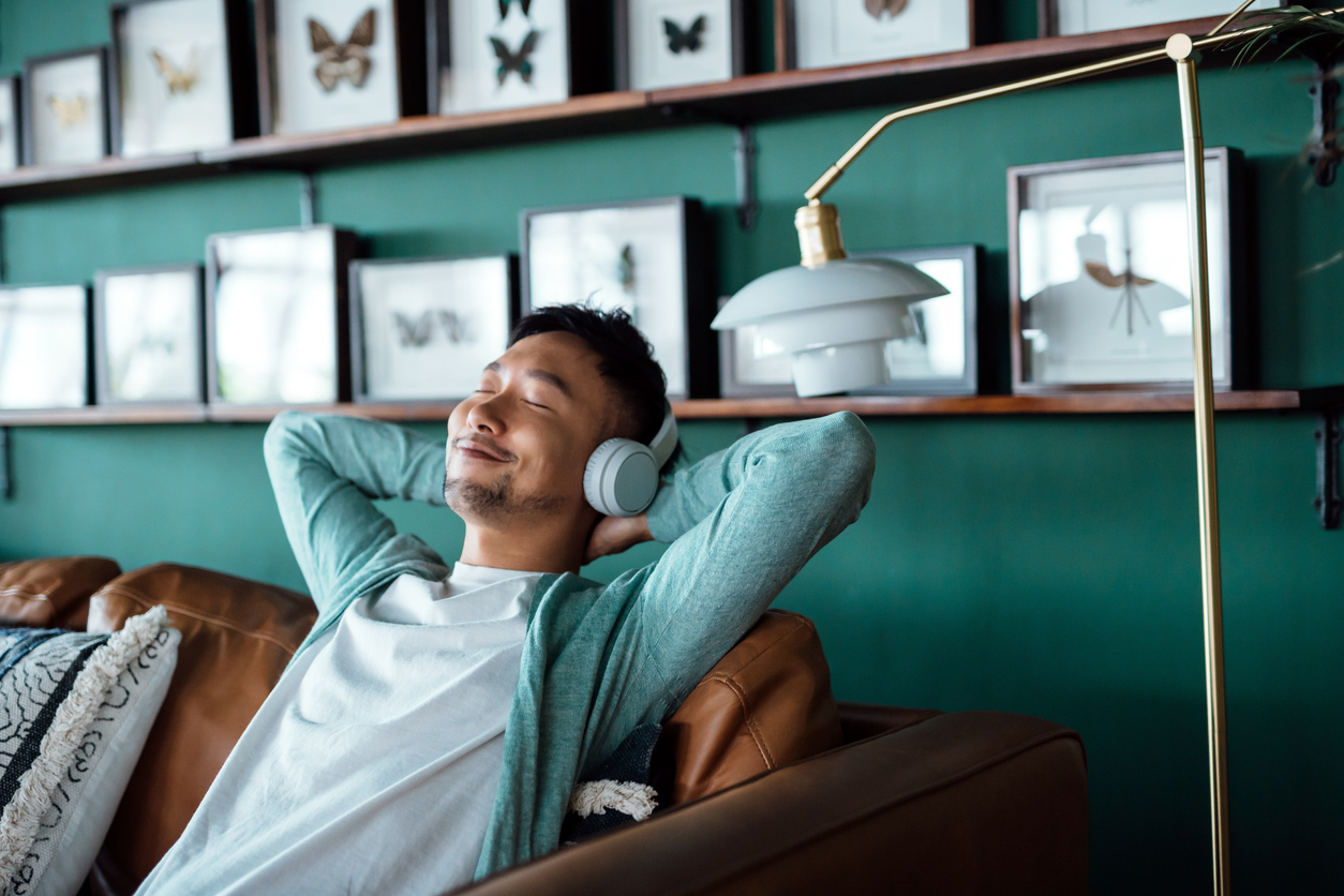 young asian man enjoying music 