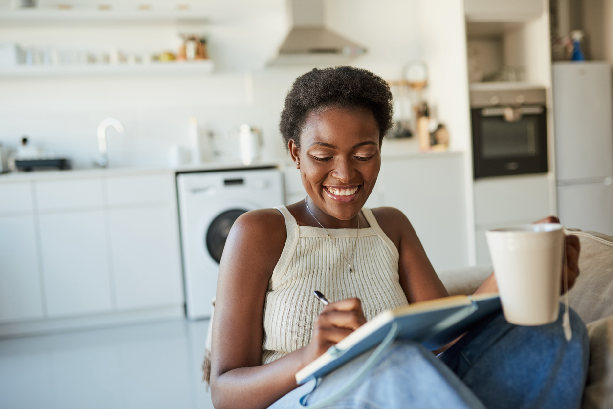 black woman journaling