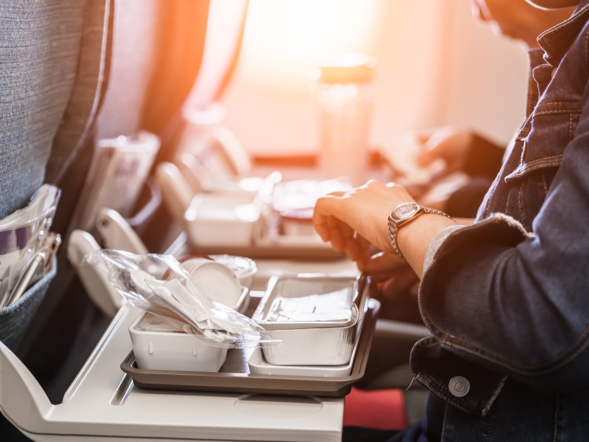 eating meal on airplane