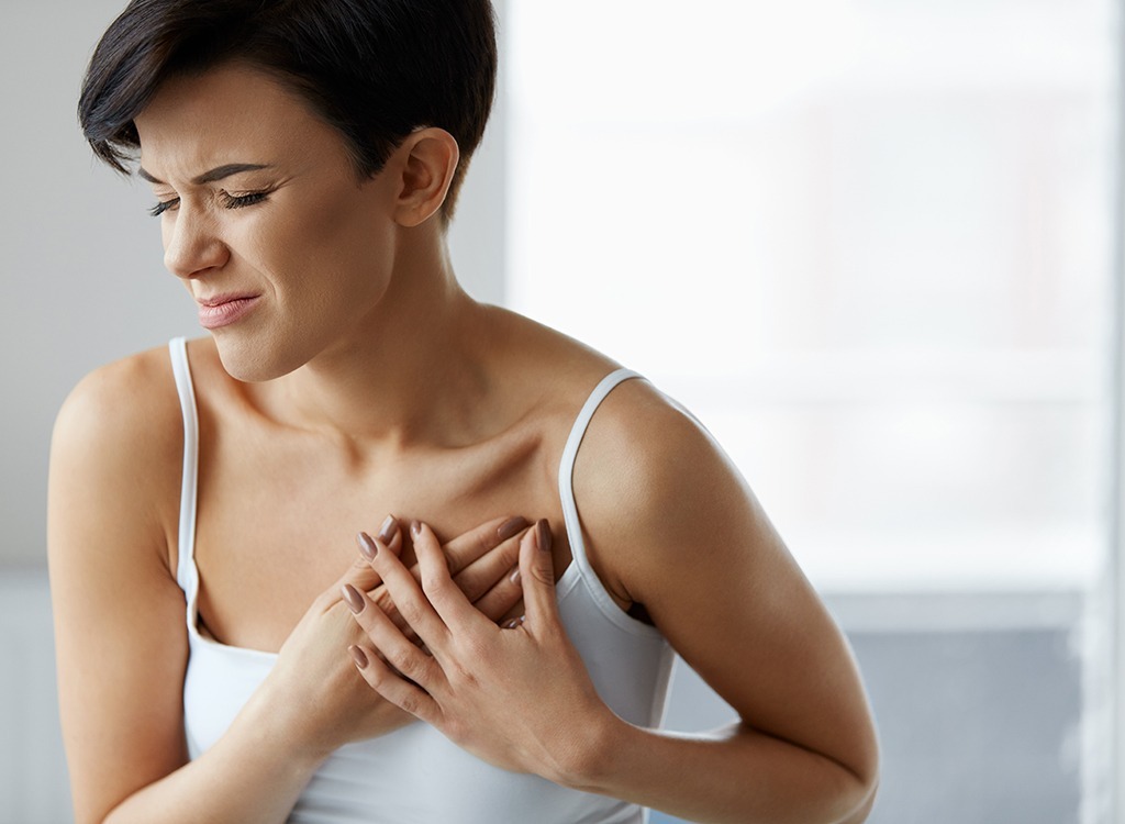 Woman clutching heart