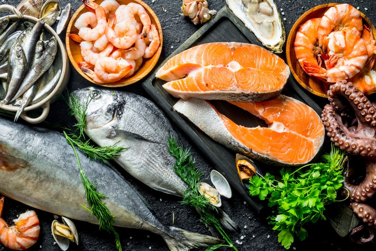 variety of fish on table, salmon and shrimp